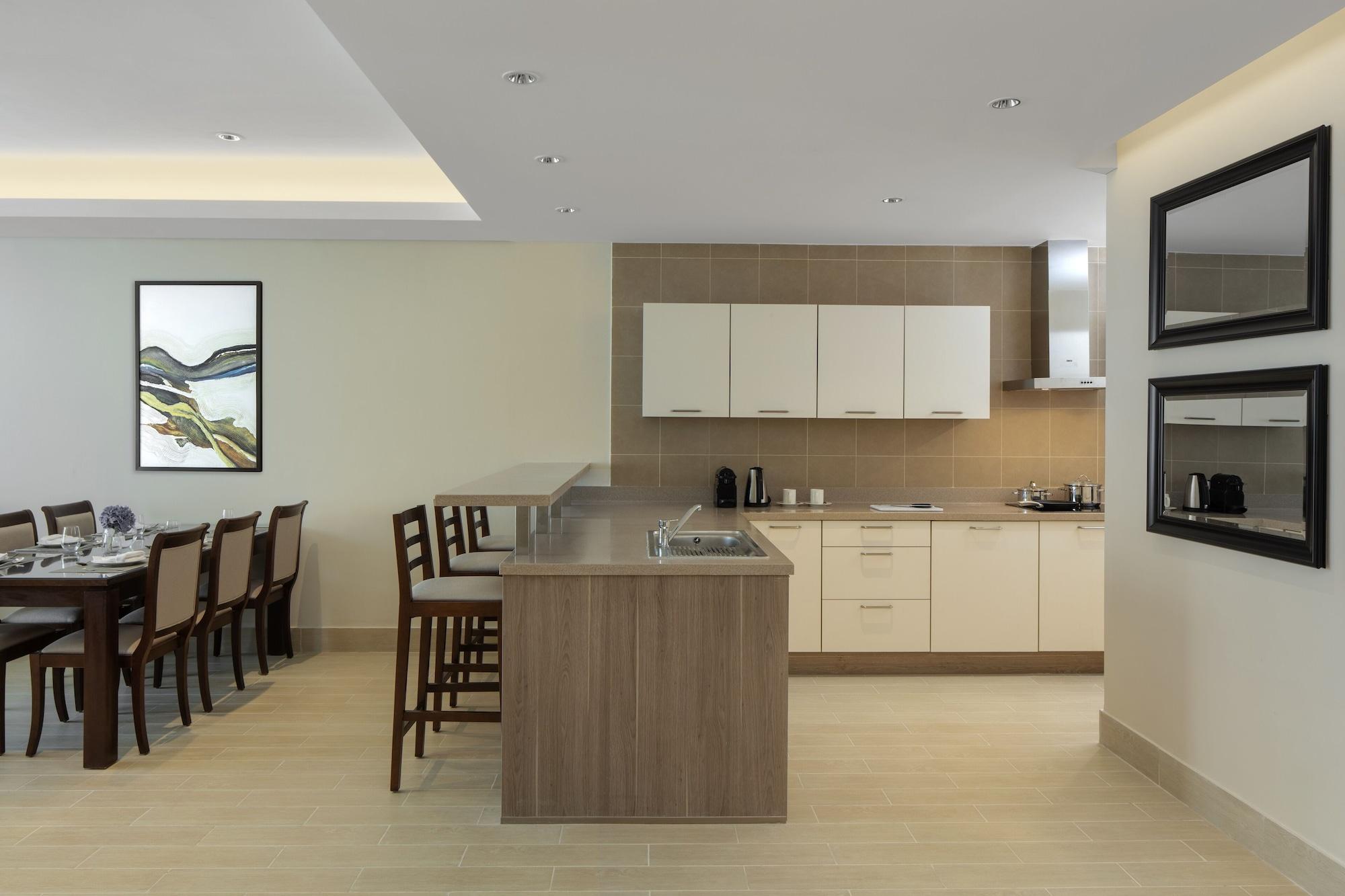 Dusit Doha Hotel Exterior photo A kitchen in a typical apartment
