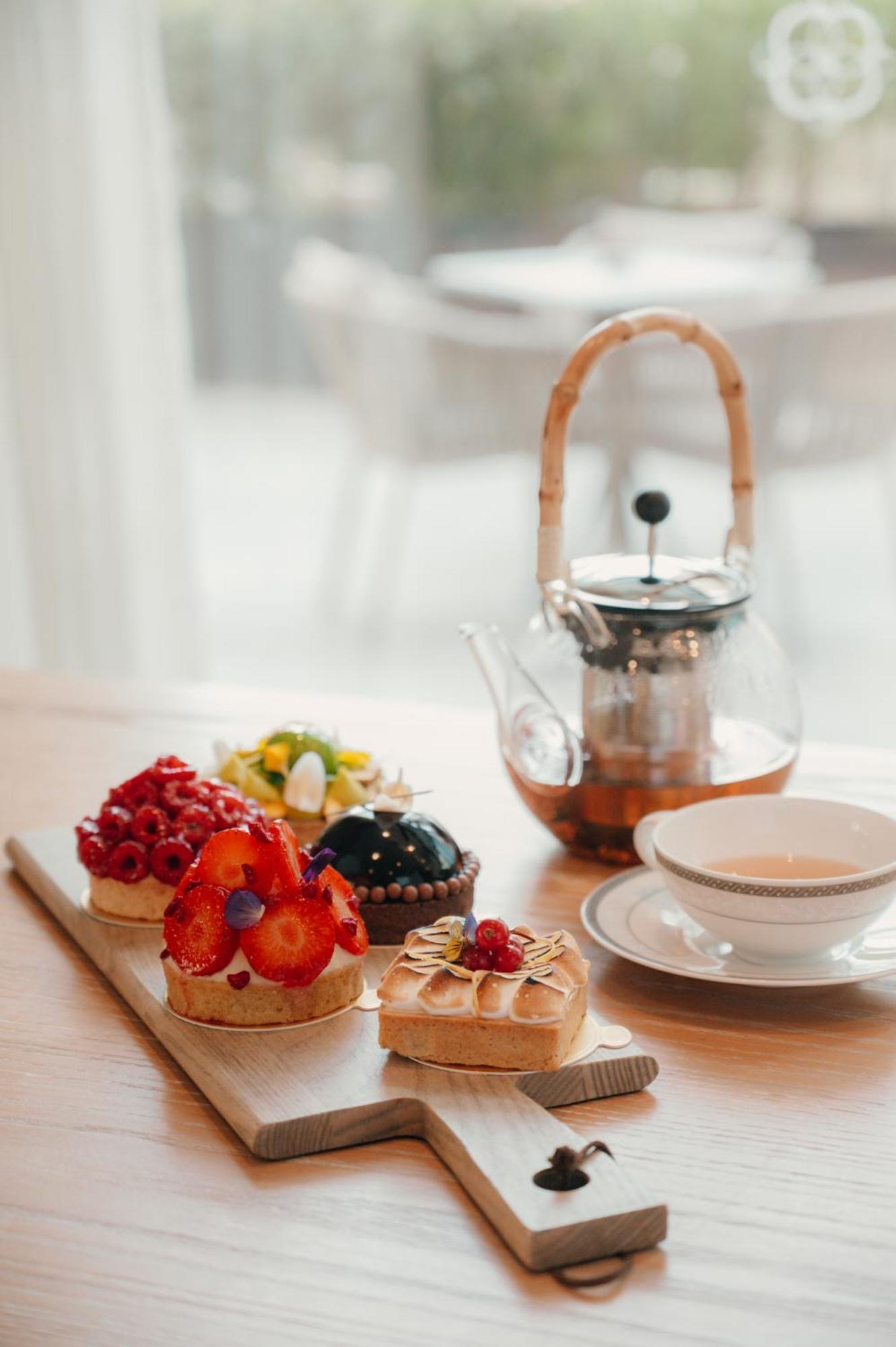 Dusit Doha Hotel Exterior photo Afternoon tea